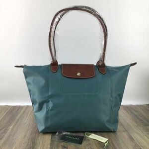 Longchamp Aqua Pouch with Gold Details